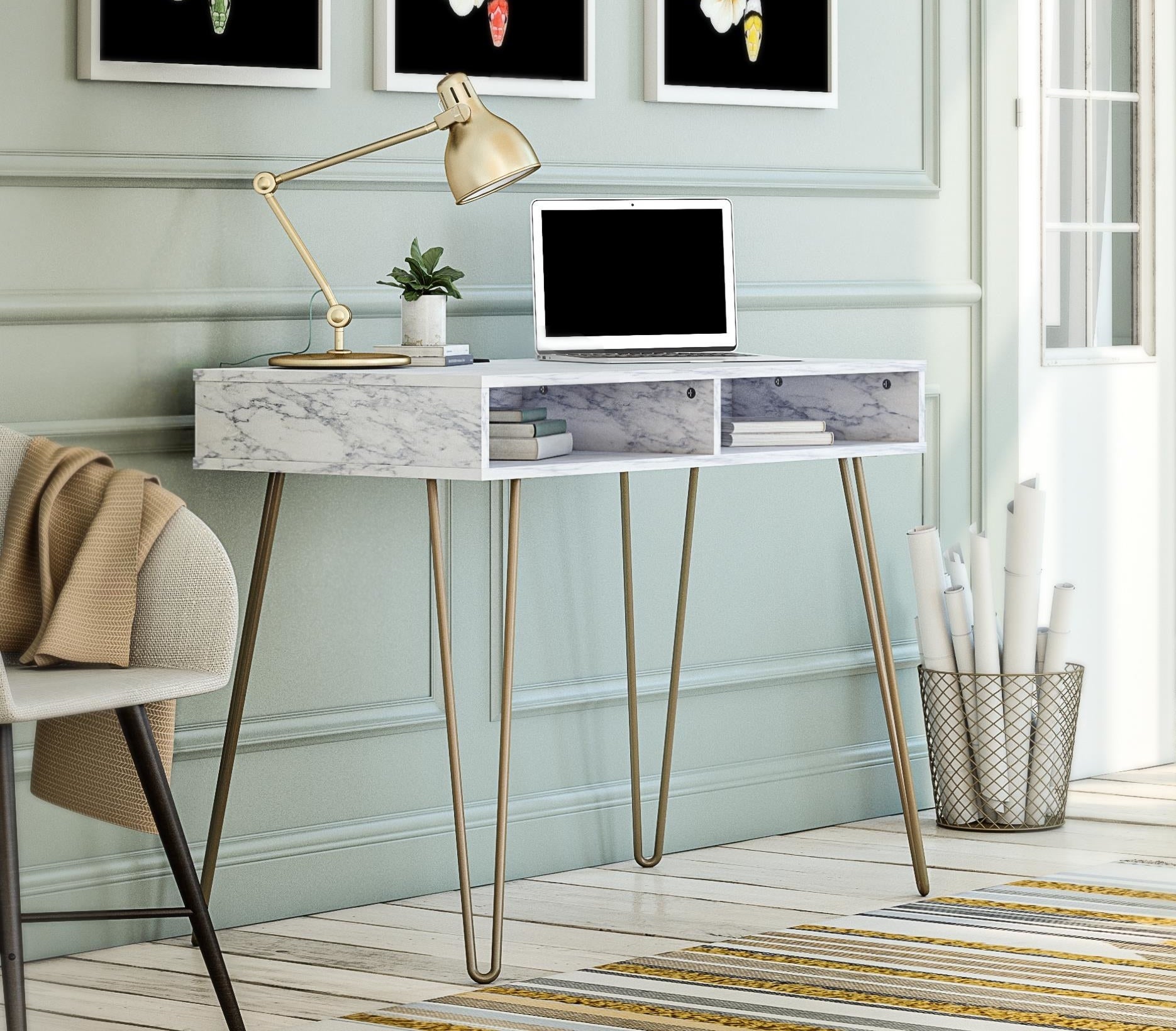 A white marble desk with gold hairpin legs