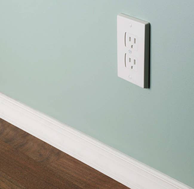 White wall outlet with slide covers