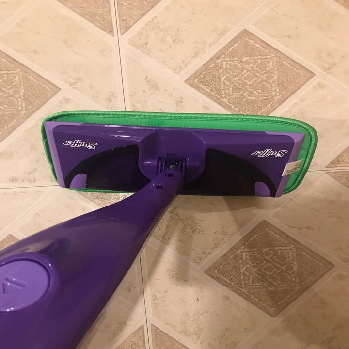 Reviewer photo of the pad being used with their Swiffer 