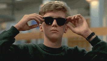 brian from the breakfast club putting on sunglasses 