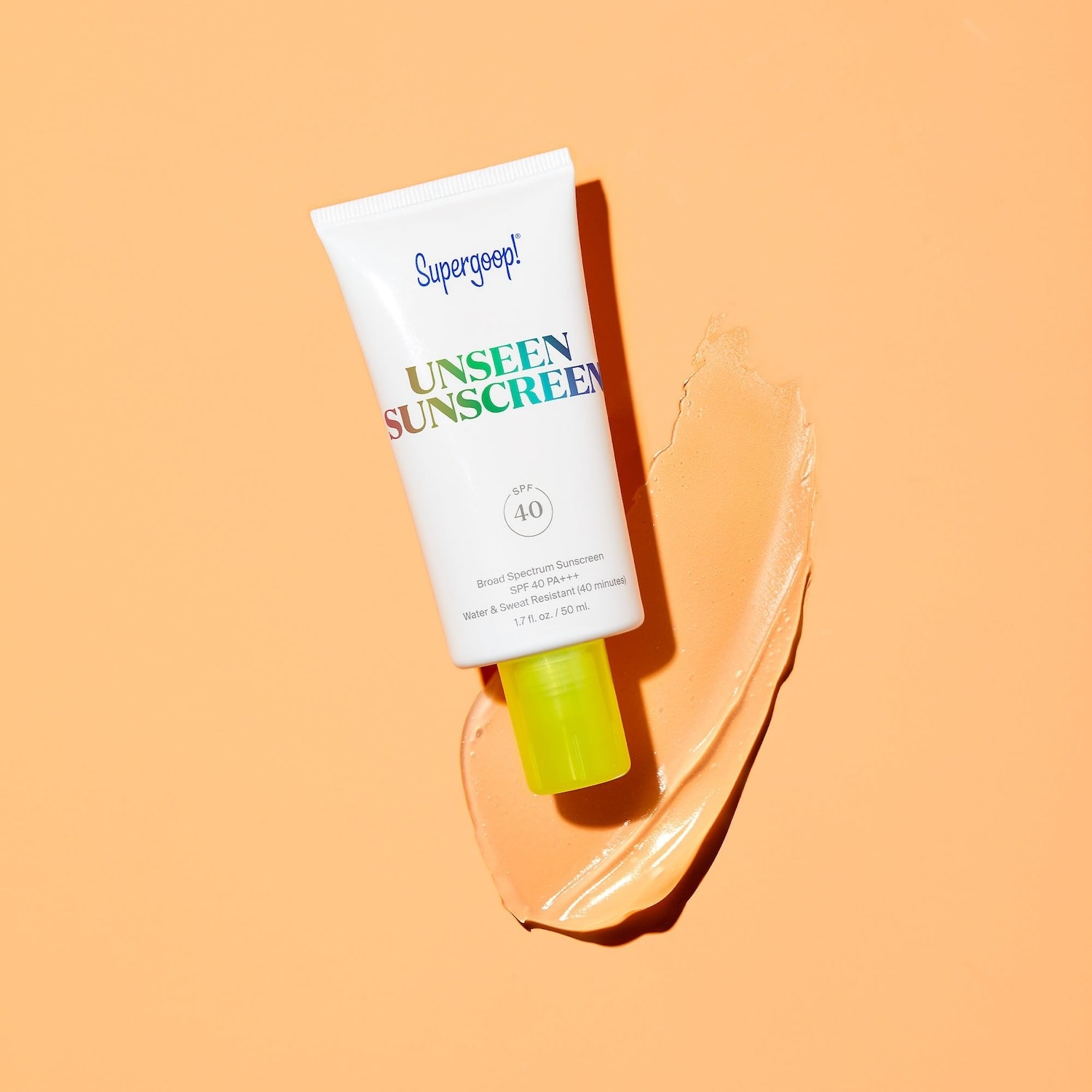 The tube of sunscreen sitting on a glob of it