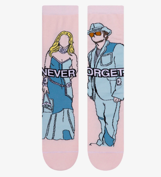 A pair of pink socks with illustrations of Britney Spears and Justin Timberlake in all denim looks. 