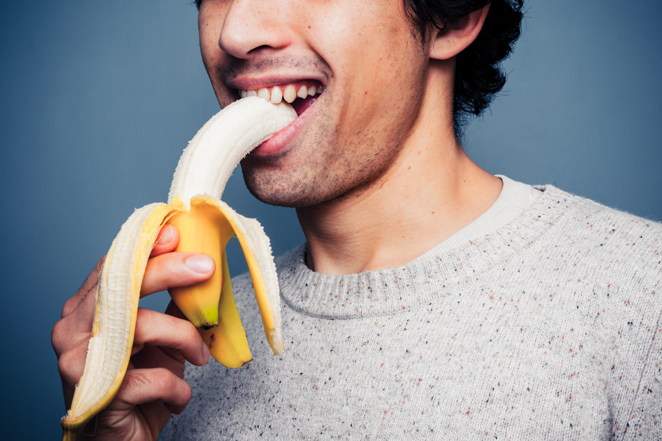 man eating banana