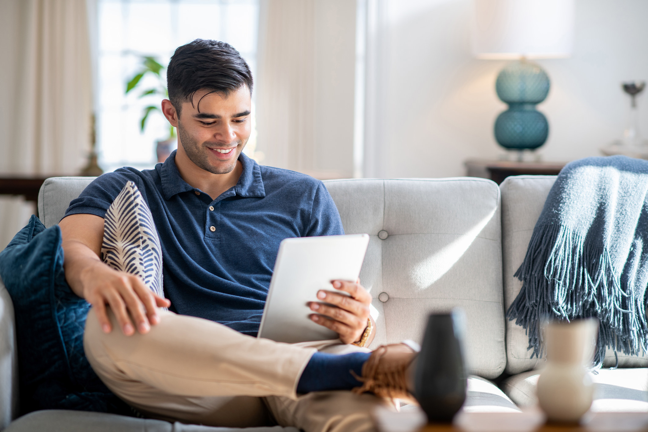 man sitting with legs crossed