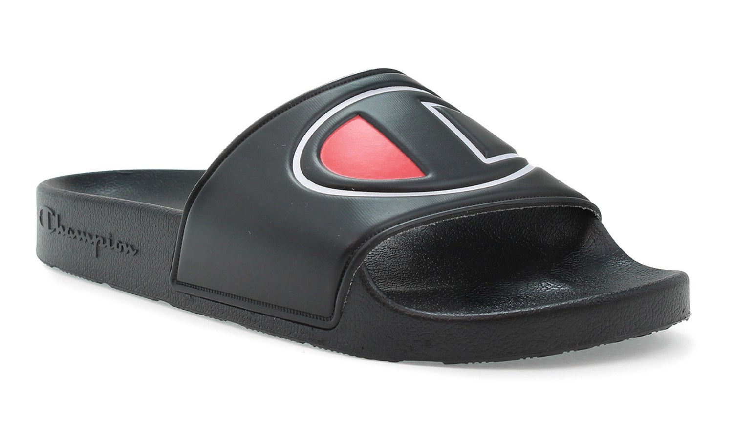 A black slide sandal emblazoned with the Champion logo