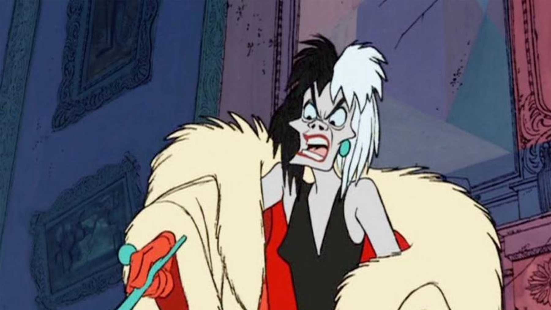 Cruella De Vill, a scrawny woman in a fur coat, points her cigarette holder at something offscreen