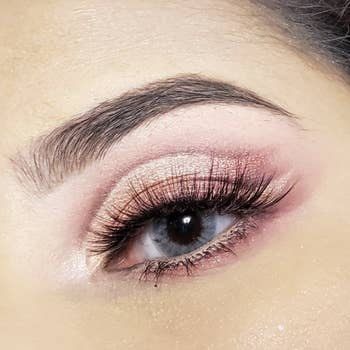 Reviewer using the palette to create a soft pink and sparkly look