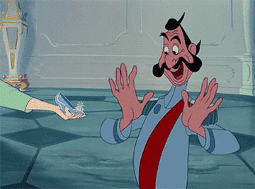 A GIF from Cindarella of an excited man being shown a glass slipper
