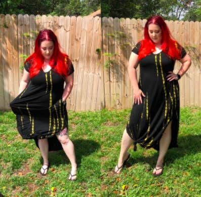 plus size reviewer wearing the black V-neck maxi dress with side slits and knotted in the front so you can see some more leg