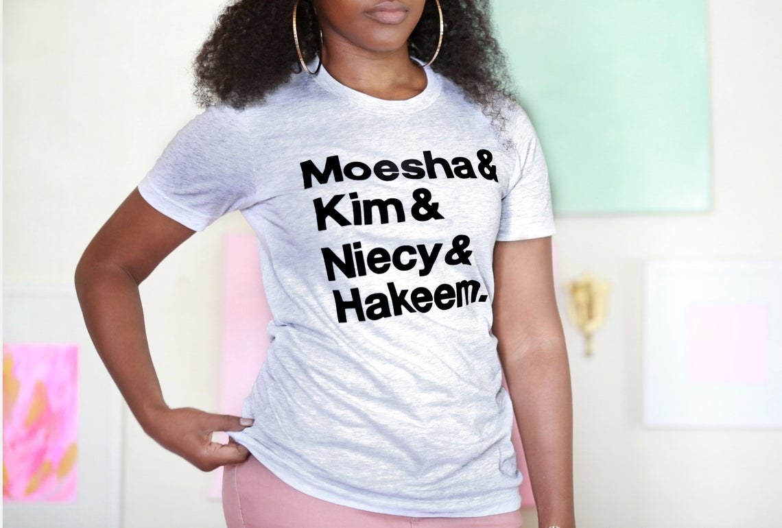 A model wearing the Moesha T-shirt
