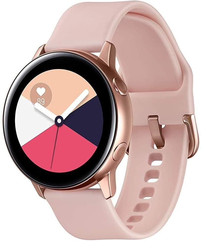 A Samsung smartwatch with a light up face, two buttons on the side, and a buckle closure at the wrist