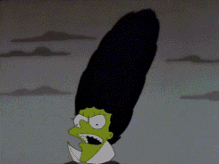 Evil Marge laughing evilly as her hair bursts into a swarm of bats. 