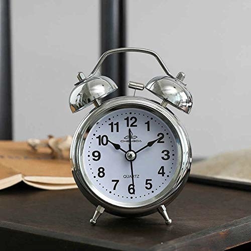 Silver alarm clock.