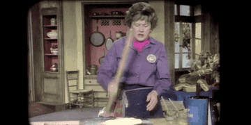 Julia Child Beating something with a rolling pin