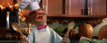 Swedish Chef from the Muppets flailing in the kitchen