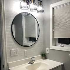 reviewer photo of bathroom with white subway tile adhesive 