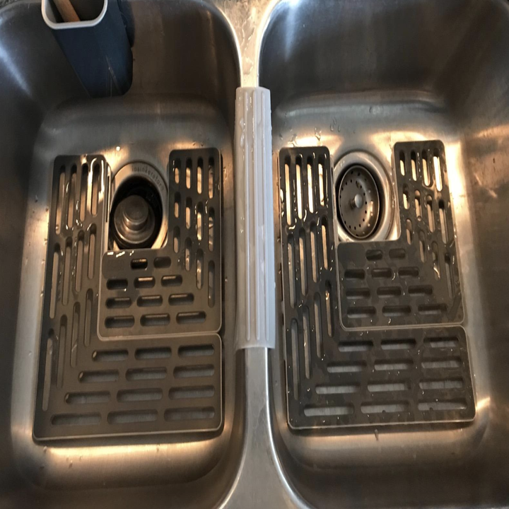 reviewer photo of gray gridded sink protector
