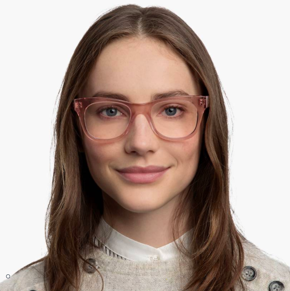 A smiling person wearing the acrylic frames
