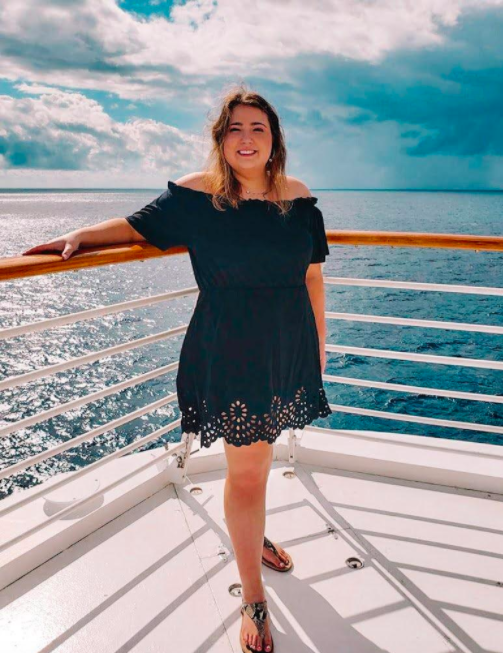 reviewer pic on boat wearing the dress in black 