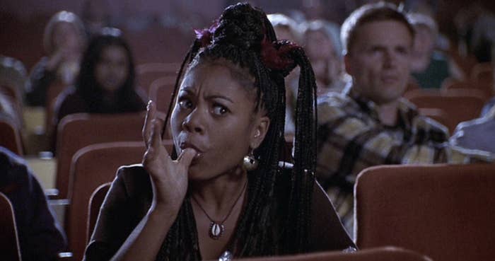 Regina Hall watching a movie in Scary Movie