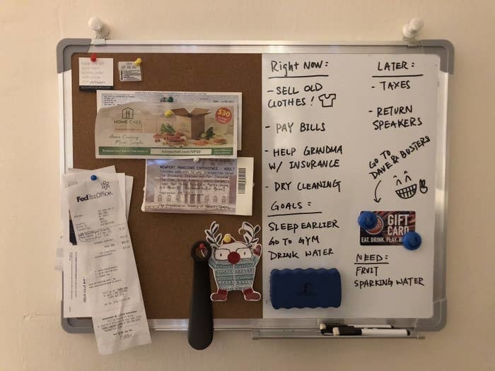 BuzzFeed Editor Yi Yang&#x27;s bulletin/whiteboard — the bulletin side has things like ticket stubs and receipts tacked onto it, while the whiteboard has a to-do and goals list written on it