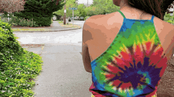 A gif of the Colortone tie-dye T-shirt styled. 
