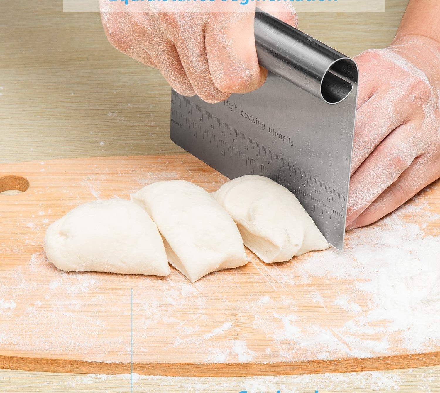 A person using the edge of the scraper to cut dough
