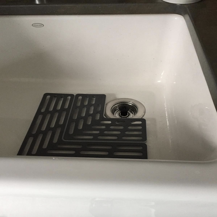 the gray protector in a laundry room sink 