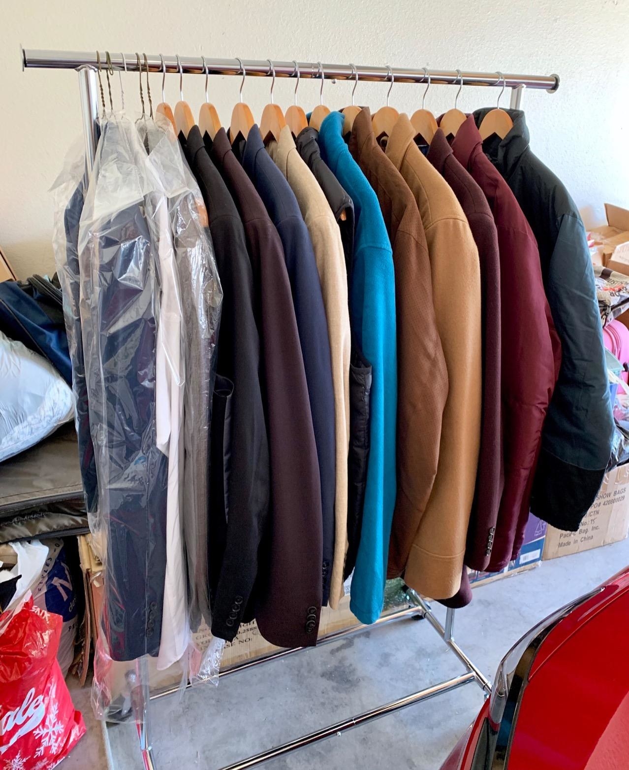 A reviewer's photo of more than a dozen jackets hung from the metallic garment rack