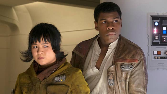 Kelly Marie Tran as Rose and John Boyega as Finn standing next to each other both looking worried.