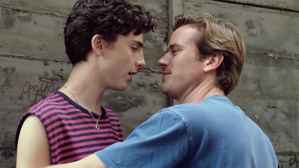 Armie Hammer as Oliver crowds Elio (Timothée Chalamet) against a wall. 