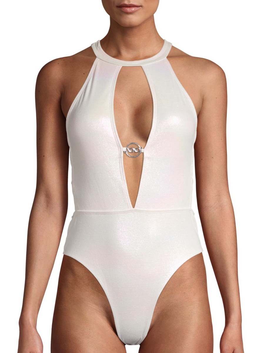 Model in a a shimmery plunge ivory one-piece 