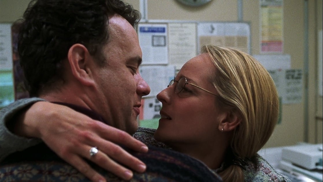 Tom Hanks as Chuck and Helen Hunt as Kelly holding each other and about to kiss.