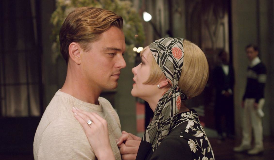 Leonardo DiCaprio as Gatsby embraces Daisy, played by Carey Mulligan.