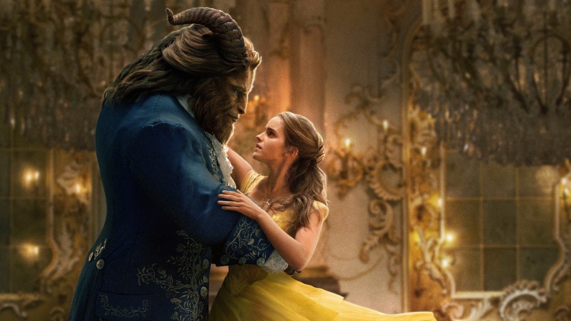 Emma Watson as Belle dances around the ballroom with the Beast (Dan Stevens).