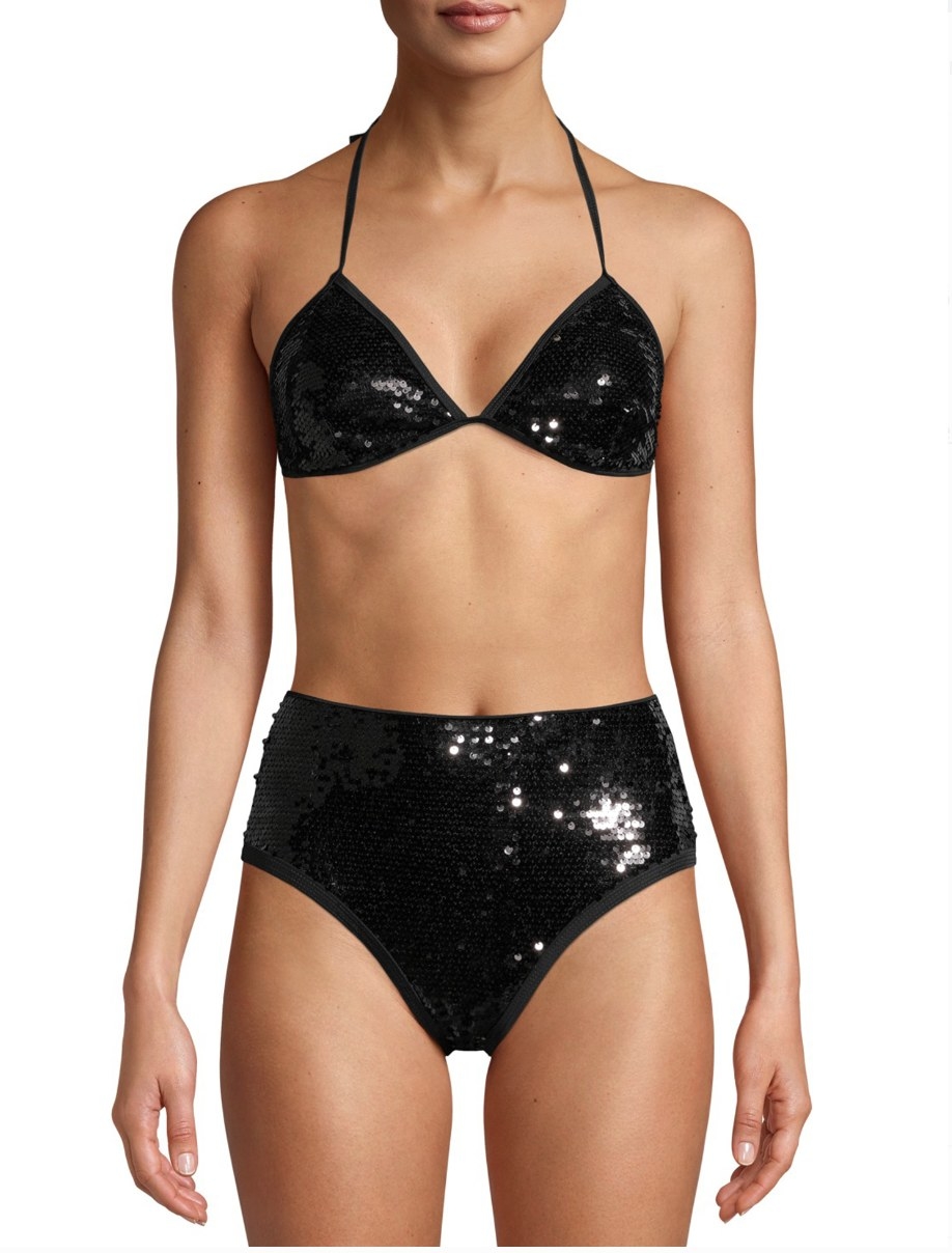 A model in a black sequined bikini 
