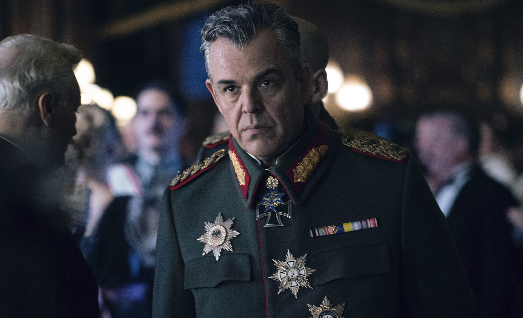 A still from Wonder Woman showing Danny Huston in a green officers uniform