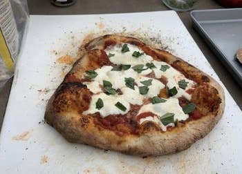 a reviewer's photo of a pizza made in the oven