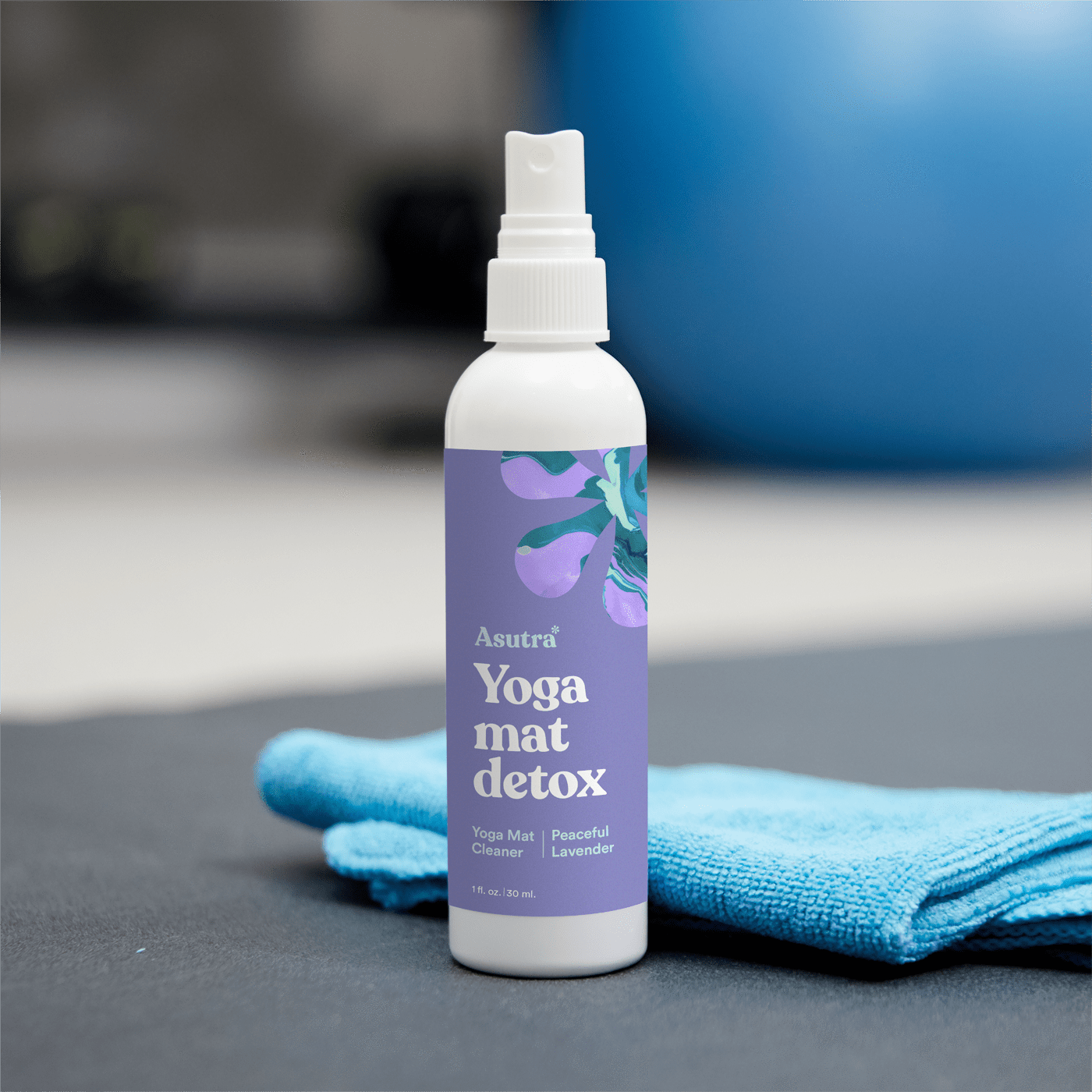 The spray bottle with a purple label with the words &quot;Yoga mat detox&quot; on it