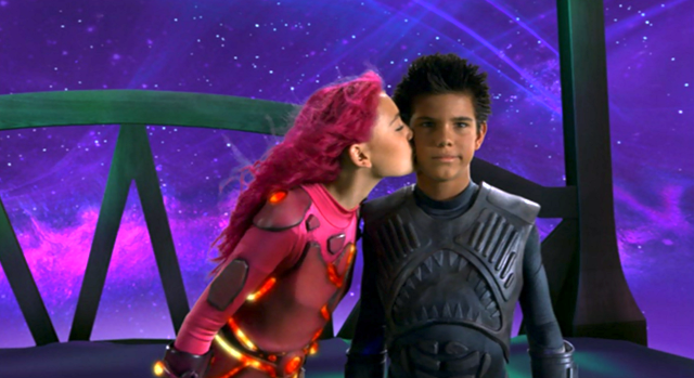 Lavagirl kissing Sharkboy on the cheek