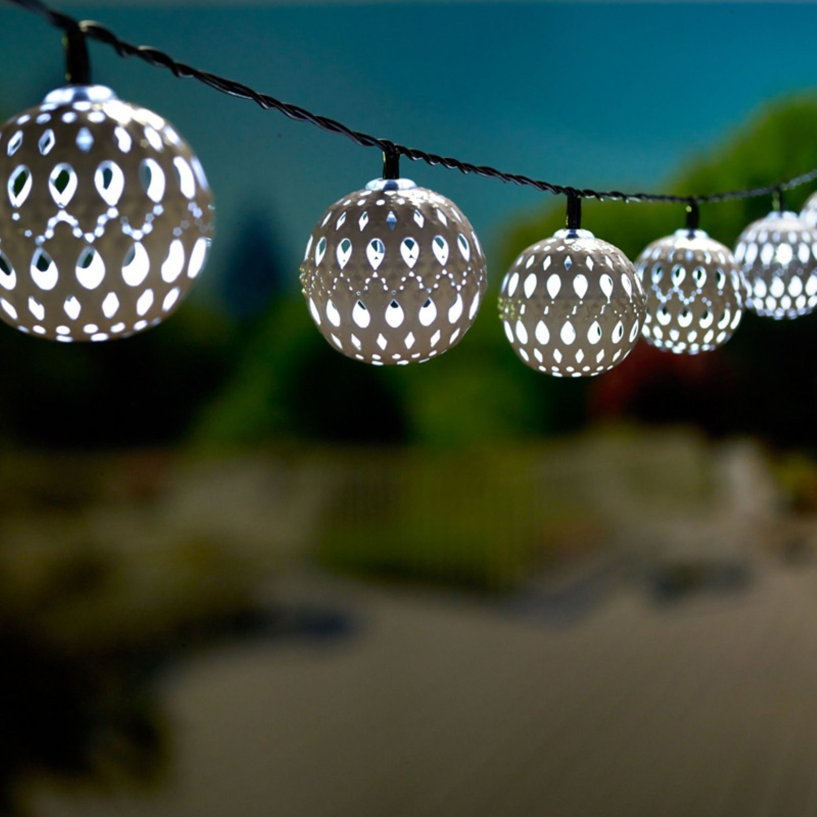 ball string lights with delicate designs on them