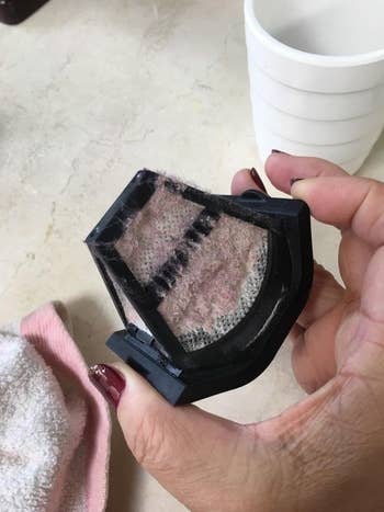 Reviewer's vacuum filter filled with dust