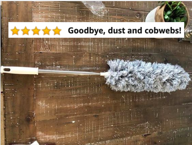Reviewer&#x27;s picture of the extendable duster with Amazon five-star caption, &quot;Goodbye, dust and cobwebs!&quot;
