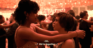 A gif from I am not okay with this the netflix show in which the main characters Sidney and Dina dance together at prom. The text reads so... so... oh... okay