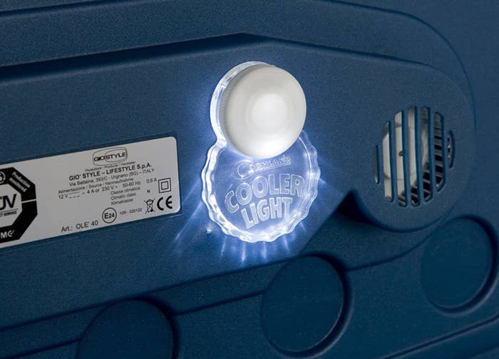A lit-up cooler light on the lid of a cooler