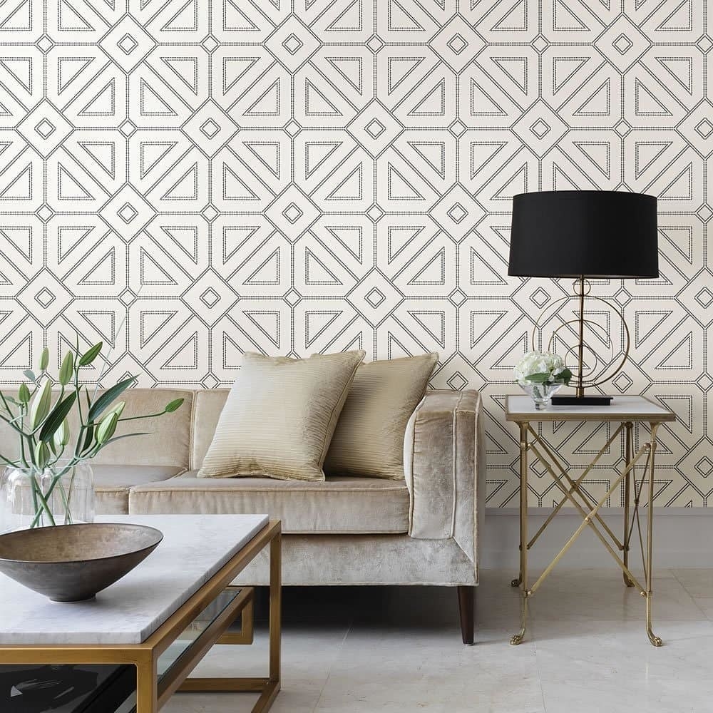 A geometric print wallpaper is used to create an accent wall 