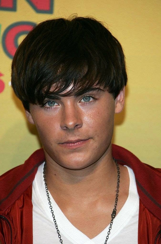 Zac Efron with a side bang hairstyle/