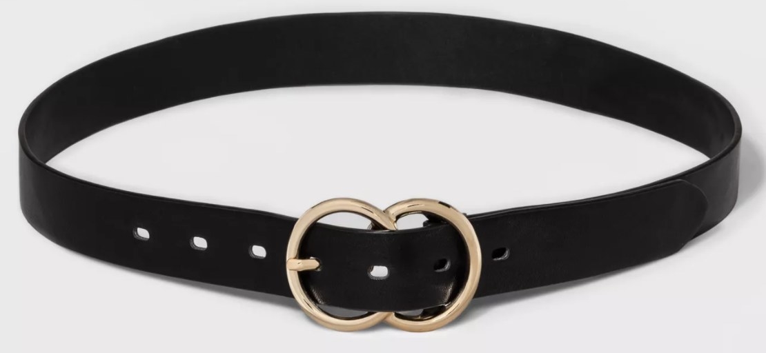 A black belt with double circle gold buckle