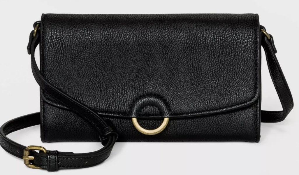 A black crossbody bag with metal buckles and clasps