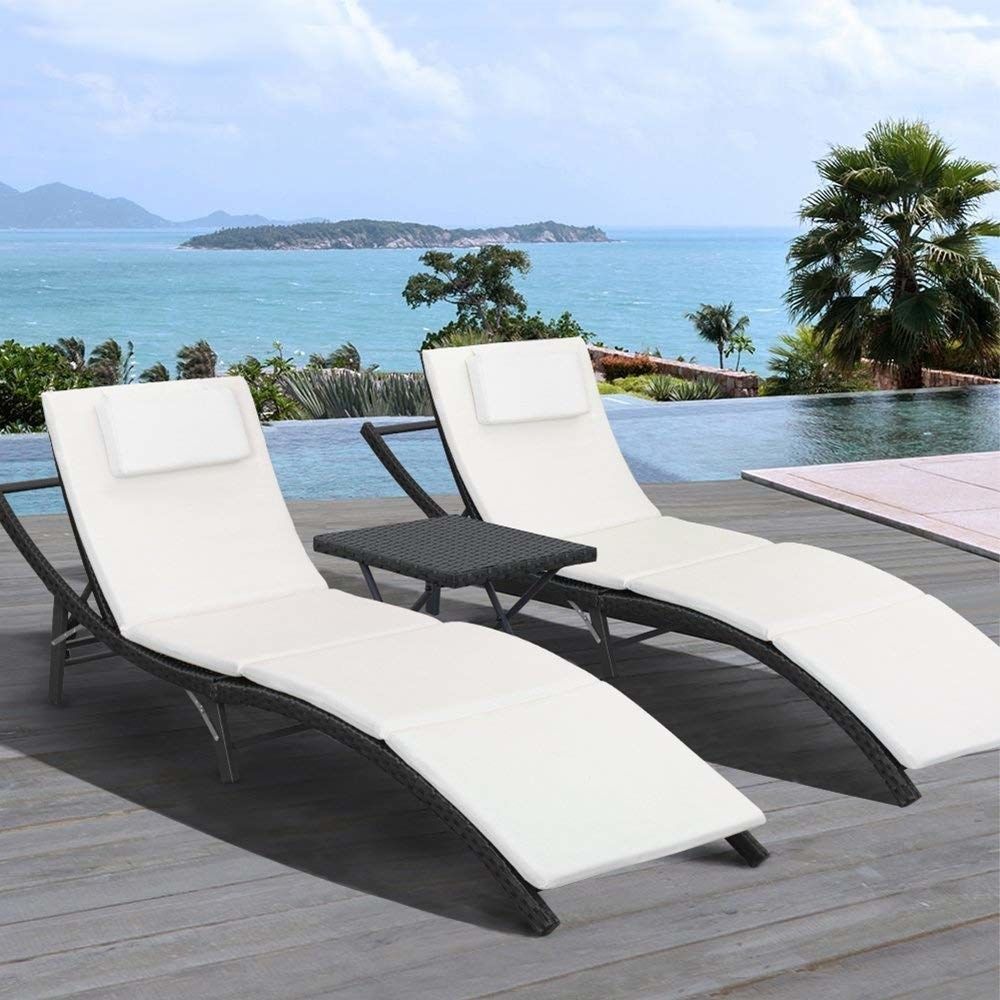 two white chaise lounges